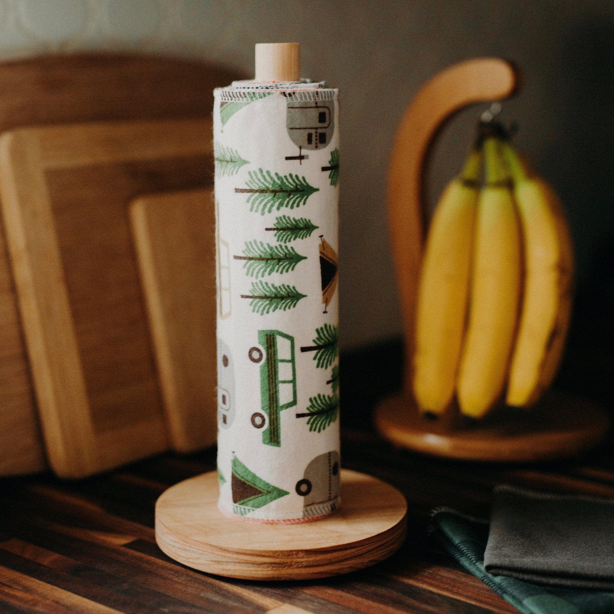 Marley's Monsters UNpaper® Towels + Wooden Holder shows cotton flannel reusable paper towels rolled like paper towels.